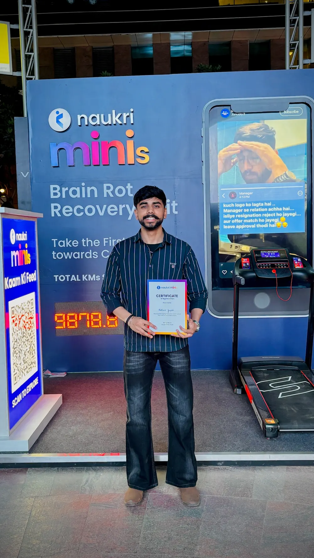 Nishant at the Naukri Minis booth holding a certificate